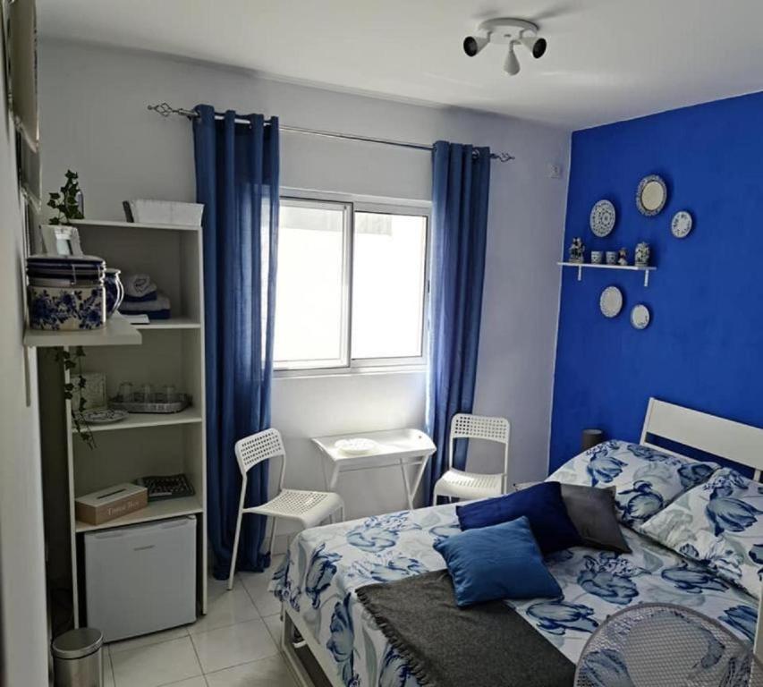 Postel nebo postele na pokoji v ubytování Deluxe B&B "Casa Alegria", Tarrafal