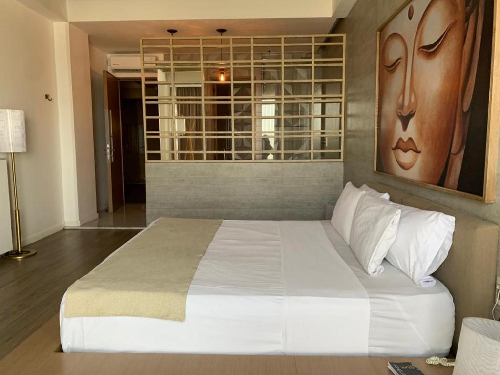 Postel nebo postele na pokoji v ubytování Motel Okura Villas y Suites