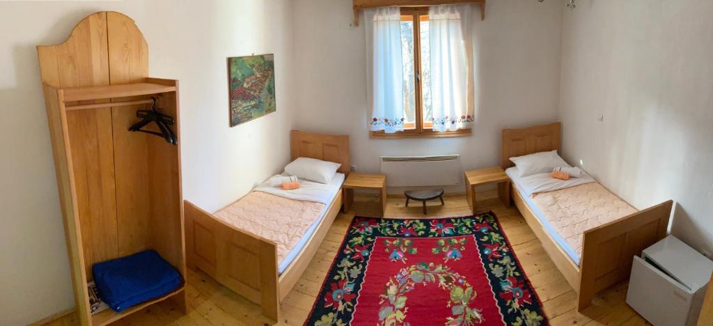 Кровать или кровати в номере Etno kutak Prijepolje
