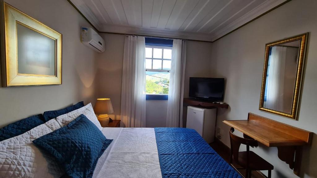 Postel nebo postele na pokoji v ubytování Hotel Pousada Casa Grande