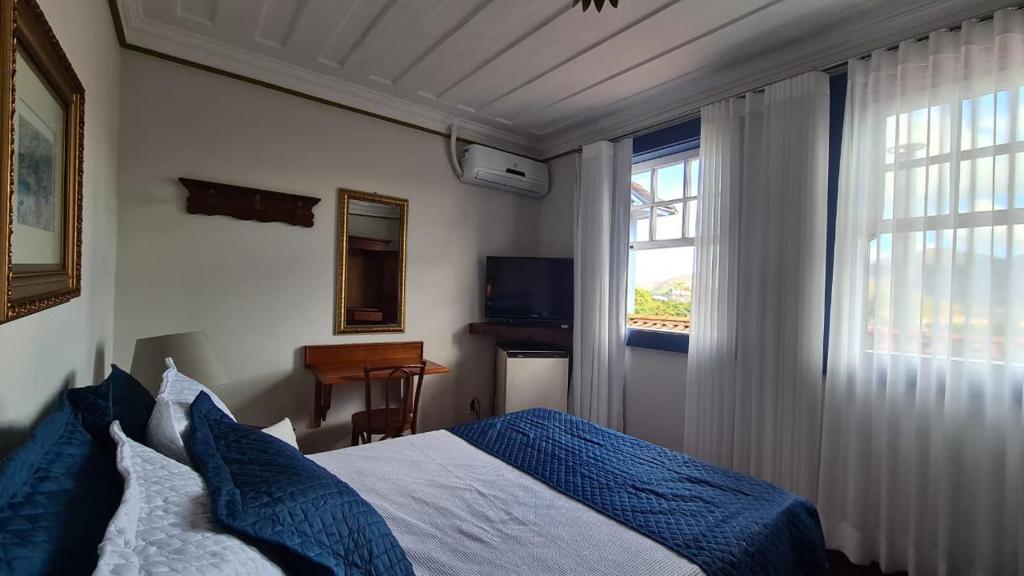 Postel nebo postele na pokoji v ubytování Hotel Pousada Casa Grande