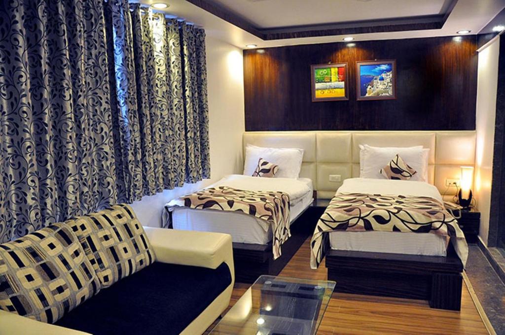 Postel nebo postele na pokoji v ubytování Hotel Elegance