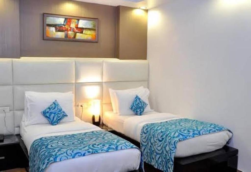 Postel nebo postele na pokoji v ubytování Hotel Elegance