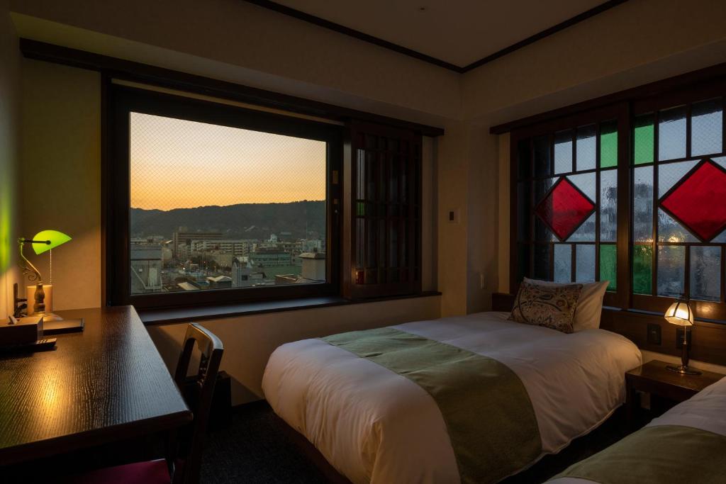 Postel nebo postele na pokoji v ubytování Hotel Aru Kyoto Sanjo Kiyamachi Do-ri