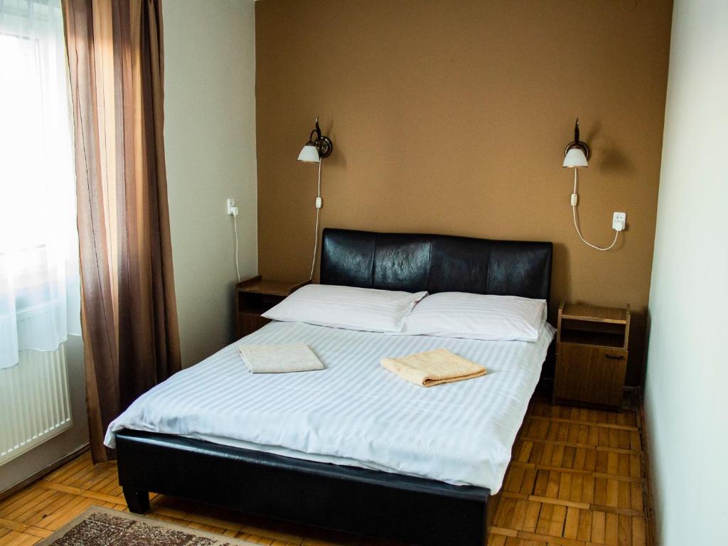 Postel nebo postele na pokoji v ubytování Zajazd Zacisze