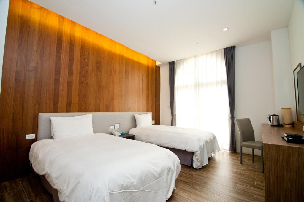 Postel nebo postele na pokoji v ubytování Hledu Hotel