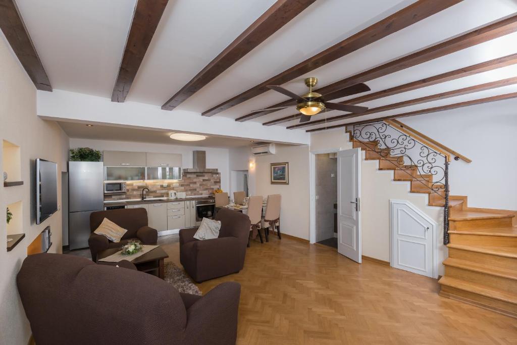 a living room with a staircase and a living room at Apartment Maru Prestige in Dubrovnik