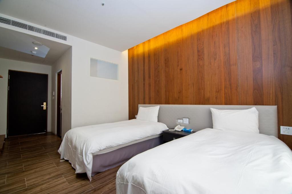 Postel nebo postele na pokoji v ubytování Hledu Hotel