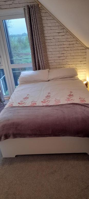 Postel nebo postele na pokoji v ubytování Annaswood B&B