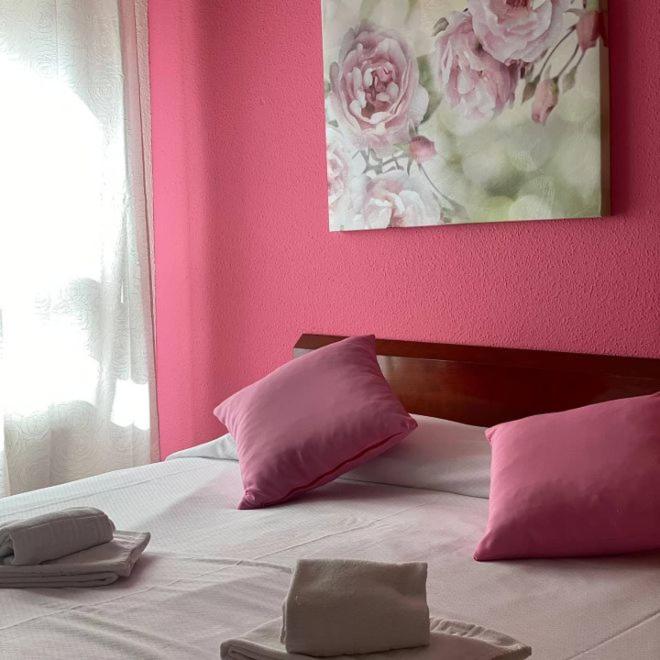 Postel nebo postele na pokoji v ubytování Hostal San Andrés