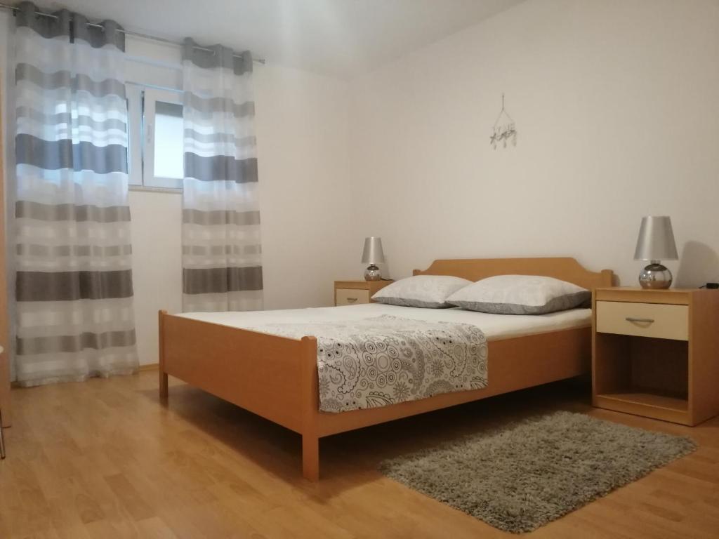 Postel nebo postele na pokoji v ubytování Matic Apartments
