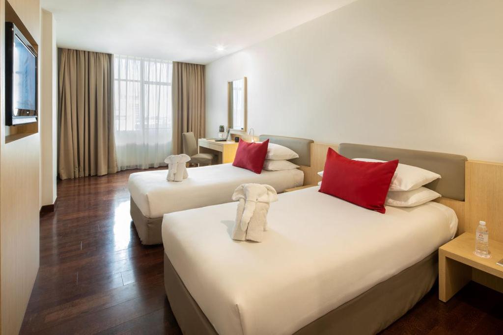 Postel nebo postele na pokoji v ubytování Rocana Hotel