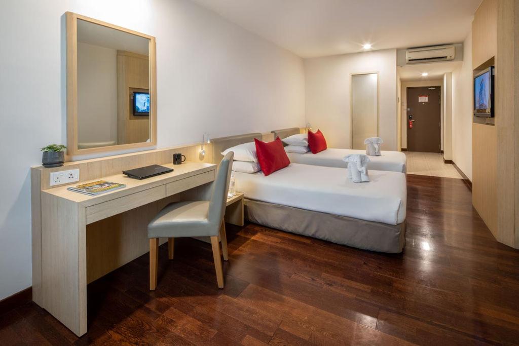 Postel nebo postele na pokoji v ubytování Rocana Hotel