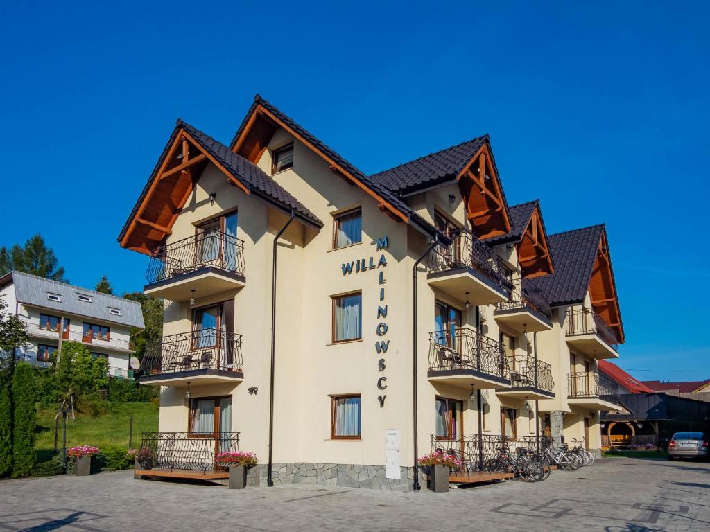 a hotel with bikes parked outside of it at Willa Malinowscy in Szczawnica