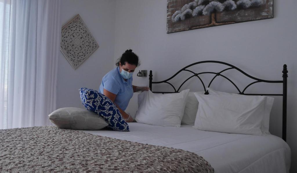 Postel nebo postele na pokoji v ubytování Garoupas Inn
