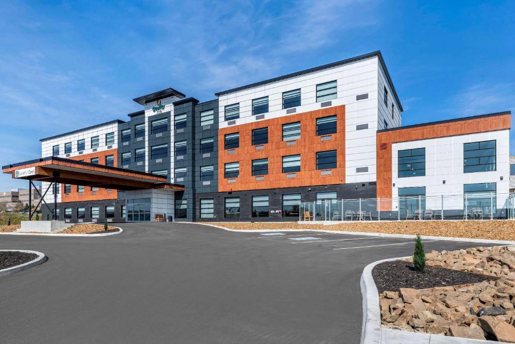 a large building with a road in front of it at Quality Hotel & Conference Centre in Edmundston