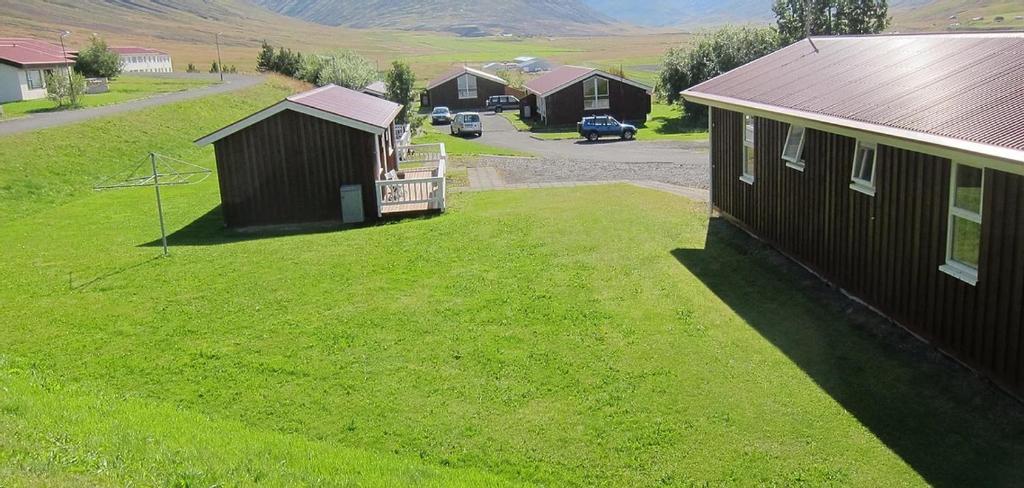 an aerial view of a yard next to a house at Kaffi Holar Cottages and Apartments in Sauðárkrókur