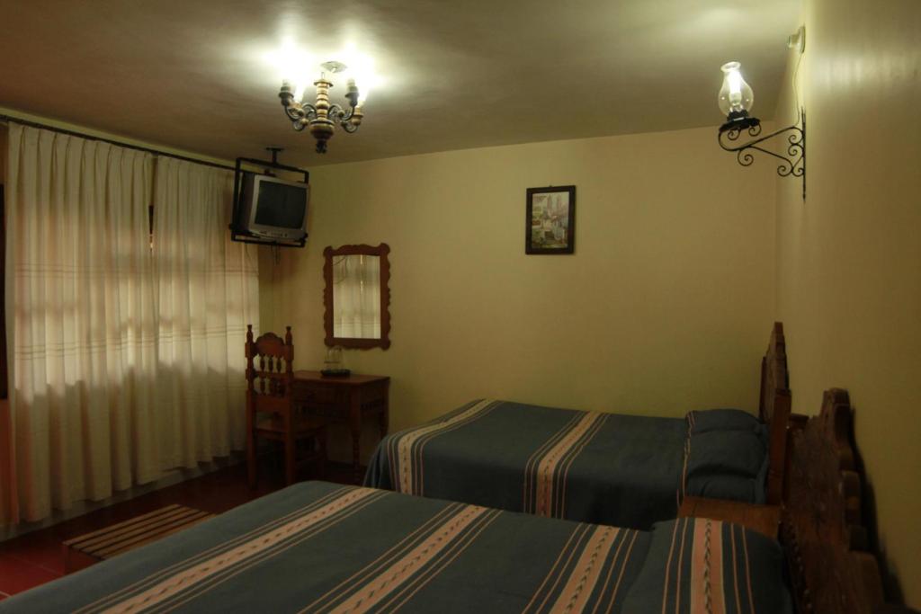 Postel nebo postele na pokoji v ubytování Posada de la Salud