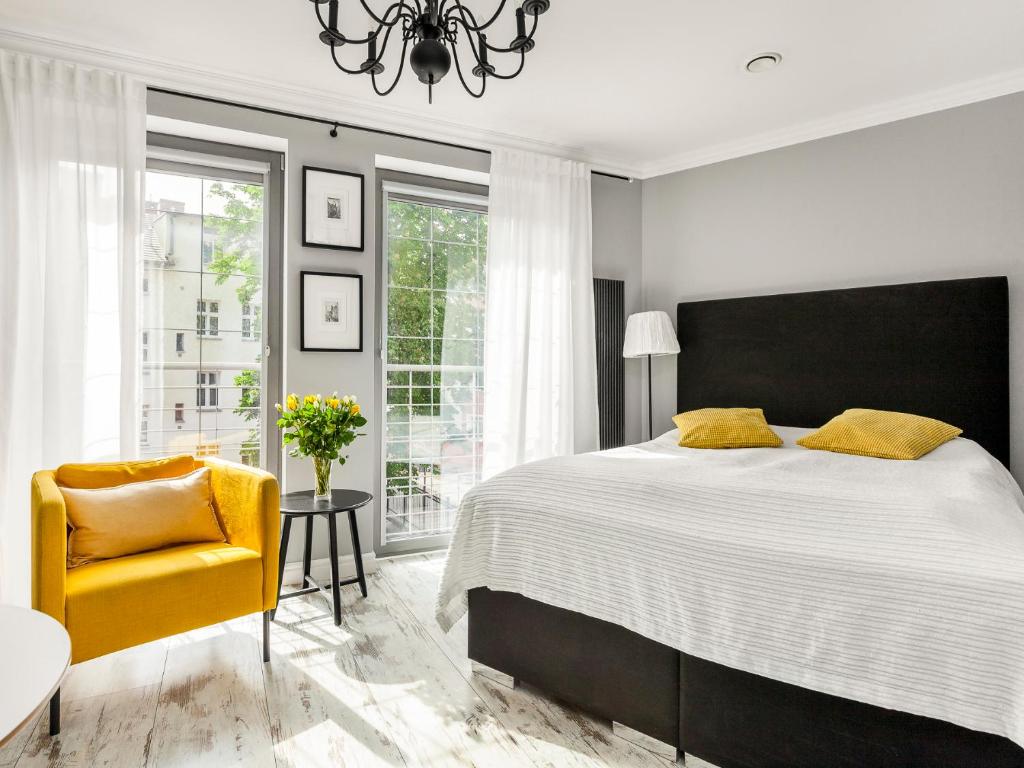 Posteľ alebo postele v izbe v ubytovaní Happy Stay Tartaczna Residence I