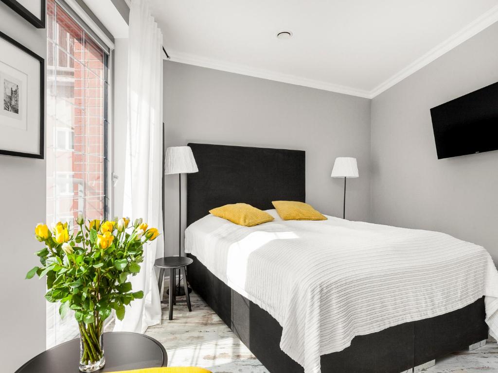 Posteľ alebo postele v izbe v ubytovaní Happy Stay Tartaczna Residence I