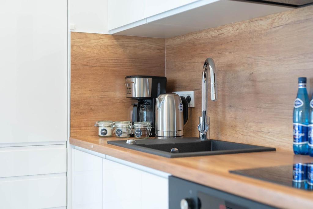 Kuchyňa alebo kuchynka v ubytovaní Apartment Flamingo 41 by Noclegi Renters