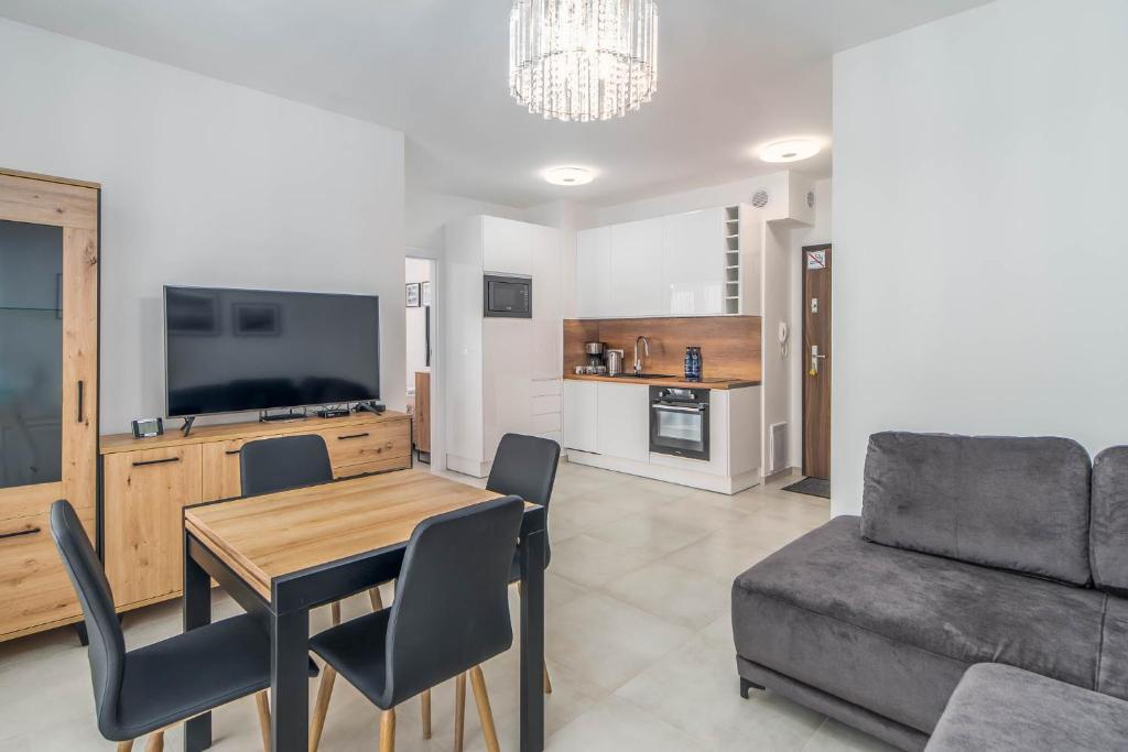 Kuchyňa alebo kuchynka v ubytovaní Apartment Flamingo 41 by Noclegi Renters
