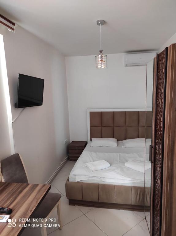 Postel nebo postele na pokoji v ubytování Hotel Heimli
