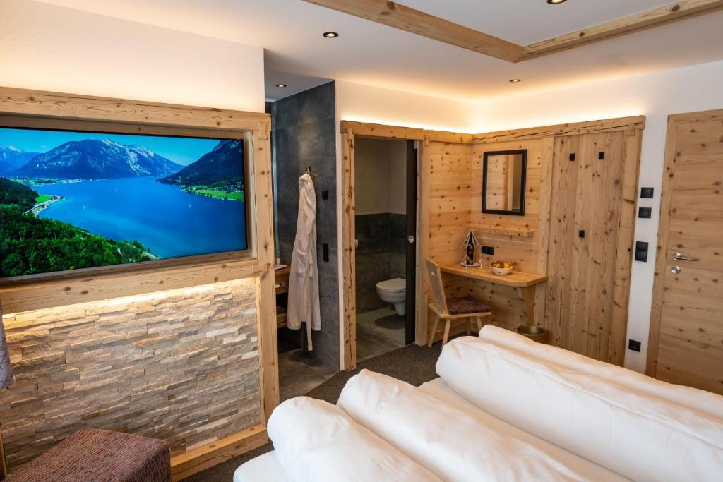 Postel nebo postele na pokoji v ubytování Hotel Huber Hochland