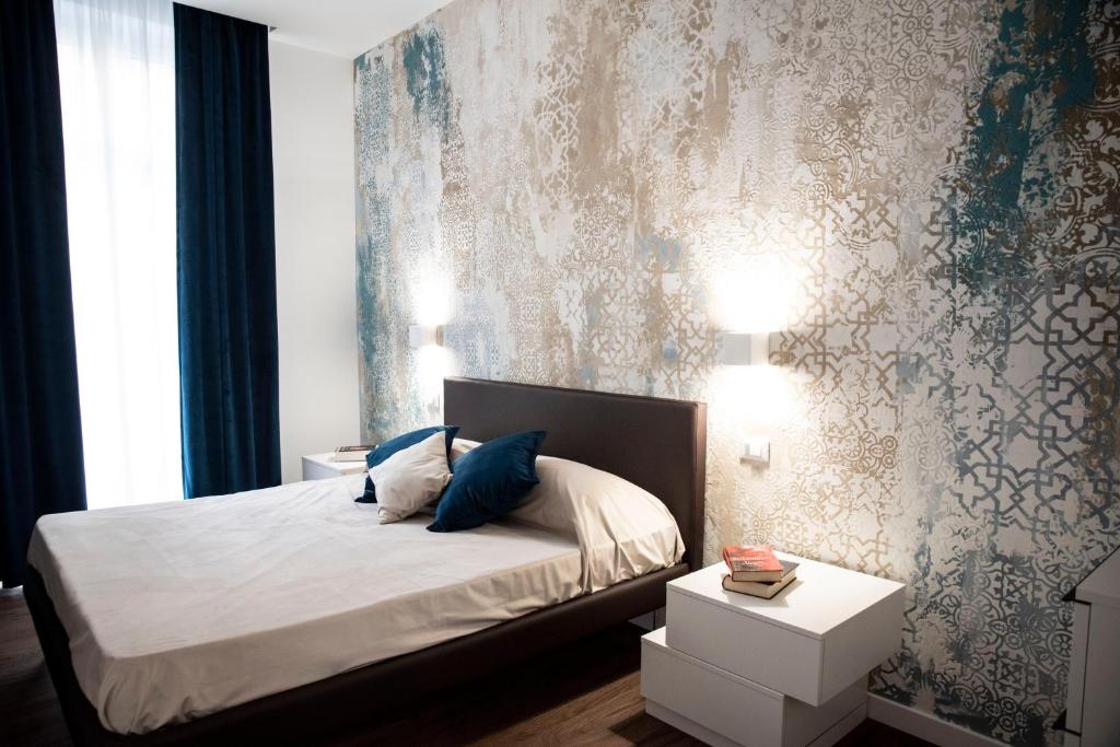 Postel nebo postele na pokoji v ubytování Fervore Luxury Rooms