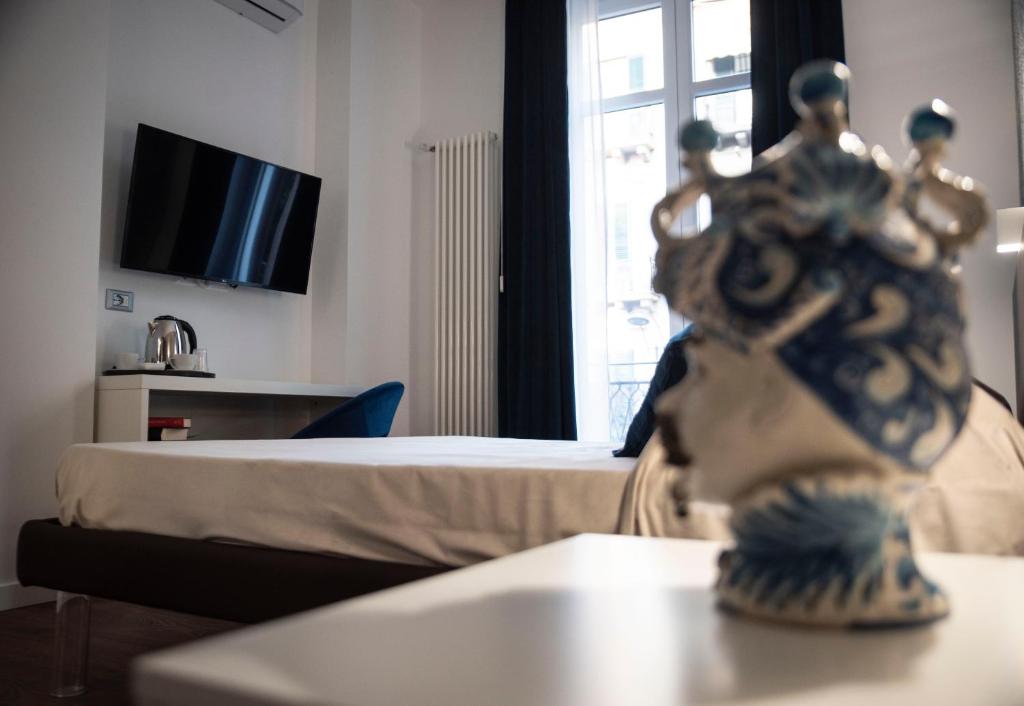 TV a/nebo společenská místnost v ubytování Fervore Luxury Rooms