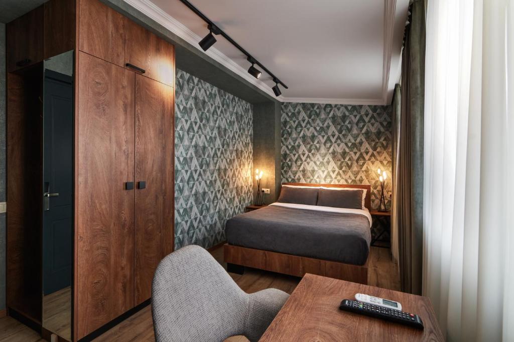 Postel nebo postele na pokoji v ubytování Hotel City
