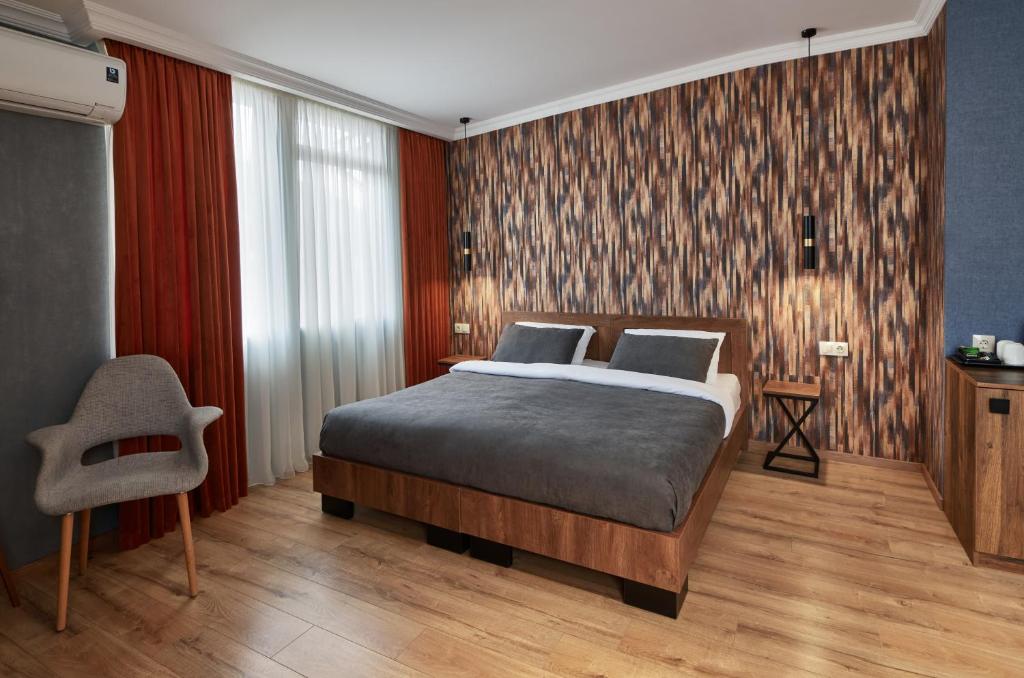 Postel nebo postele na pokoji v ubytování Hotel City
