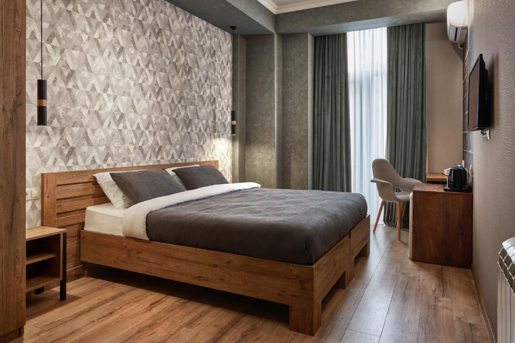 Postel nebo postele na pokoji v ubytování Hotel City