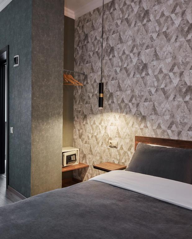 Postel nebo postele na pokoji v ubytování Hotel City