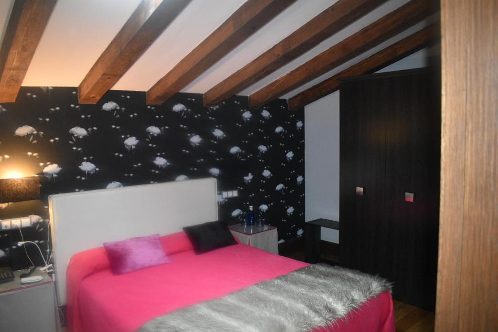 Postel nebo postele na pokoji v ubytování Posada Real Torre Berrueza