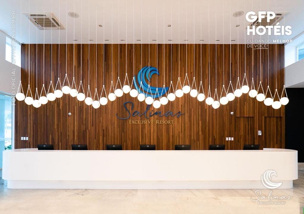 a large chandelier in the lobby of a hotel at SALINAS EXCLUSIVE - GAV Resorts in Salinópolis