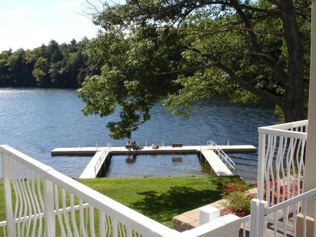 a dock in the middle of a body of water at Riverside Hotel, Ascend Hotel Collection in West Chesterfield