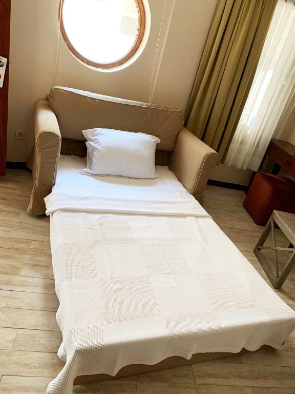 Postel nebo postele na pokoji v ubytování Mitos Hotel