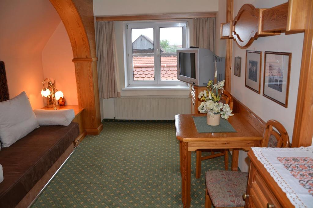 Postel nebo postele na pokoji v ubytování Hotel-Restaurant Fischer