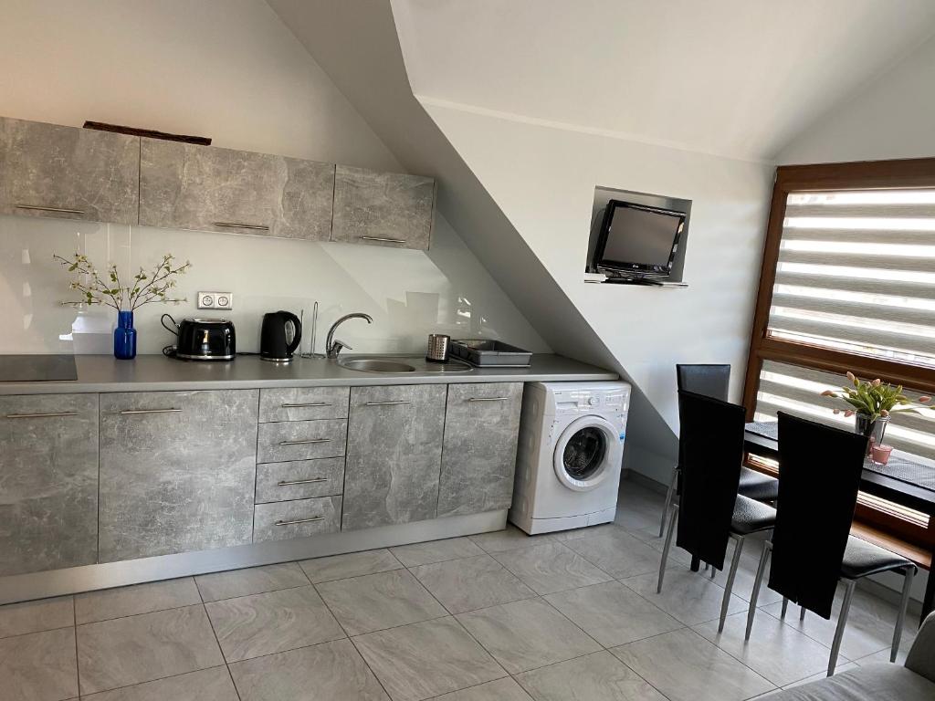 Kuchyň nebo kuchyňský kout v ubytování Apartament Jastarnia