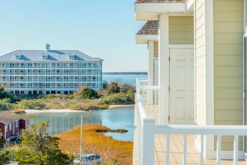 a balcony with a view of a building and a river at Lucayan 27 in Ocean City