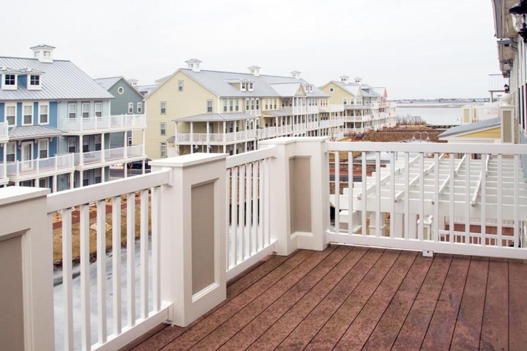 a balcony with a white fence and houses at Sunset Island - 3 Canal Side Mews in Ocean City