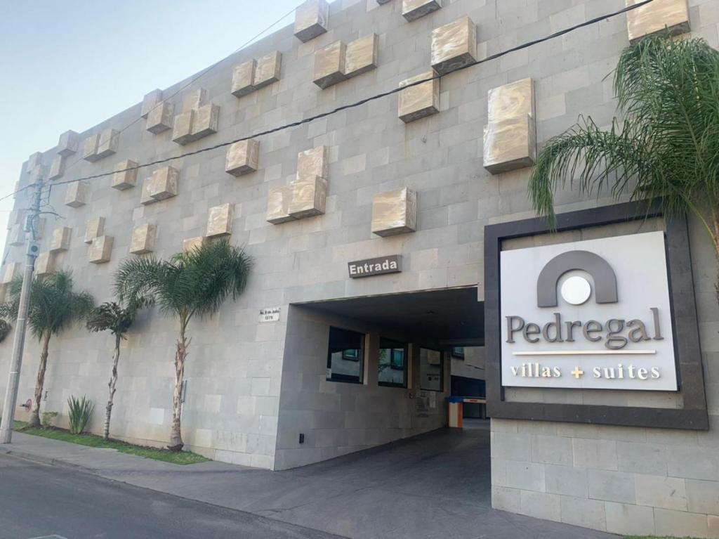 a building with a sign on the side of it at Motel Pedregal in Guadalajara