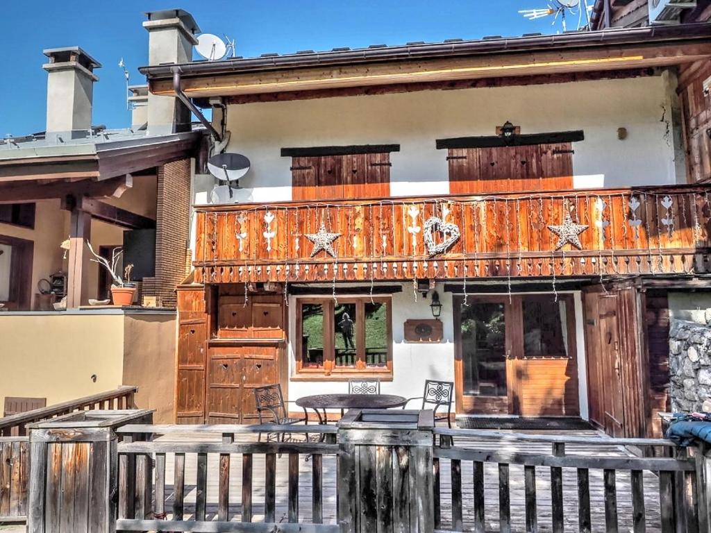 an old building with a fence in front of it at Chalet Soleil in Landry