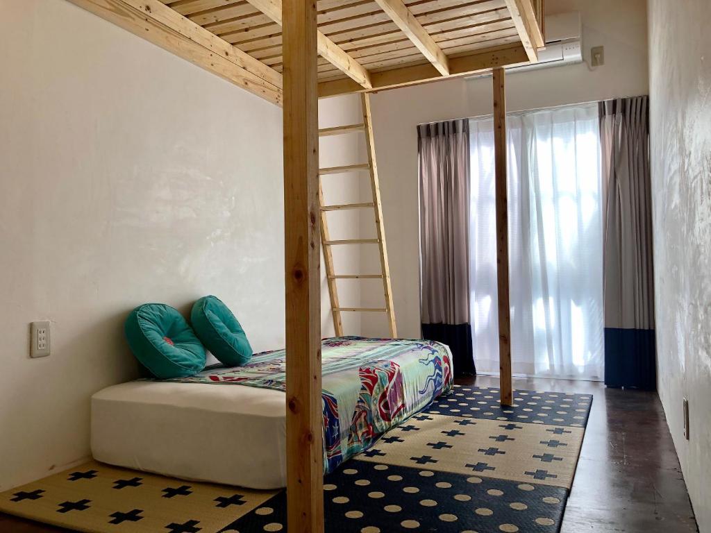 Postel nebo postele na pokoji v ubytování Hostel Yume-Nomad Kobe