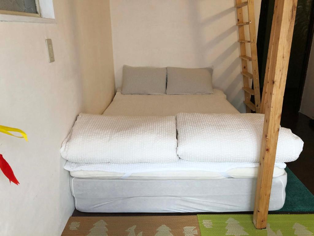Postel nebo postele na pokoji v ubytování Hostel Yume-Nomad Kobe