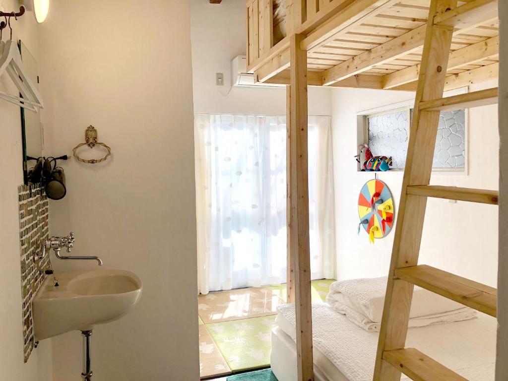 Postel nebo postele na pokoji v ubytování Hostel Yume-Nomad Kobe