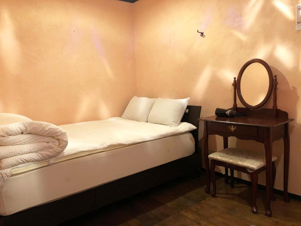 Postel nebo postele na pokoji v ubytování Hostel Yume-Nomad Kobe