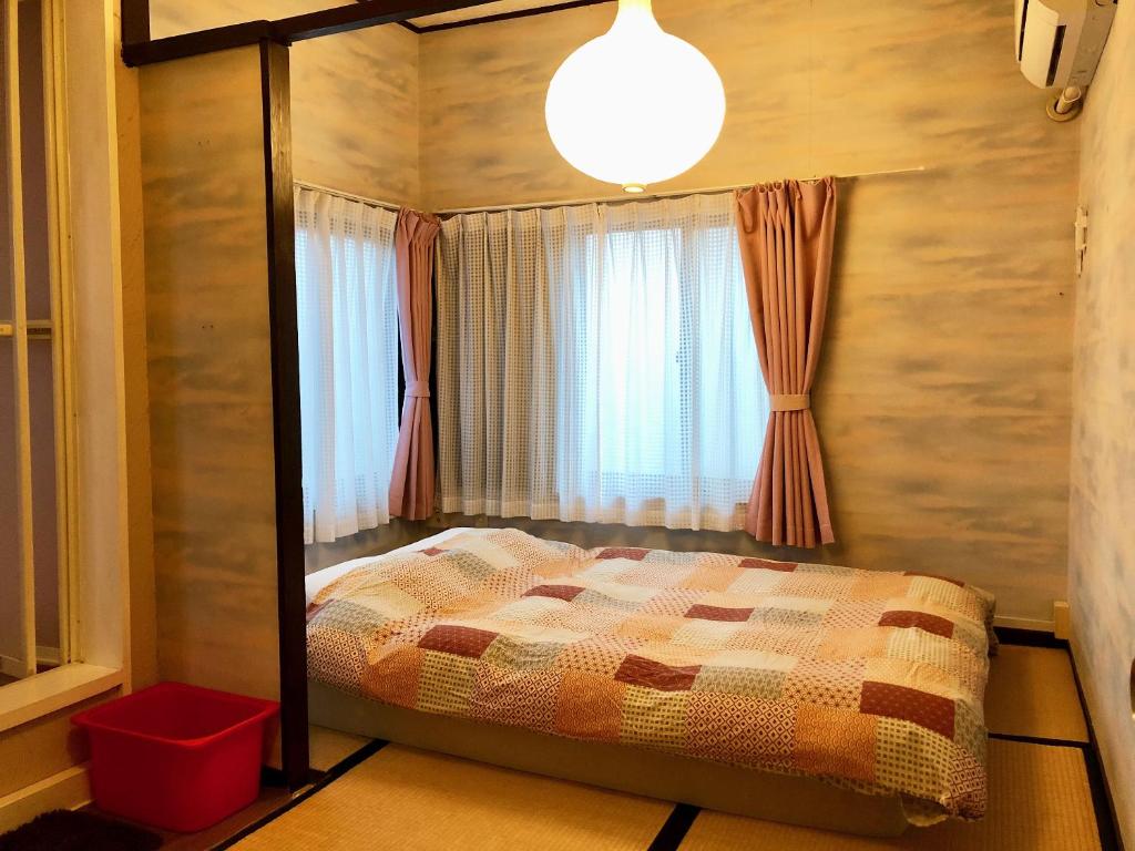 Postel nebo postele na pokoji v ubytování Hostel Yume-Nomad Kobe