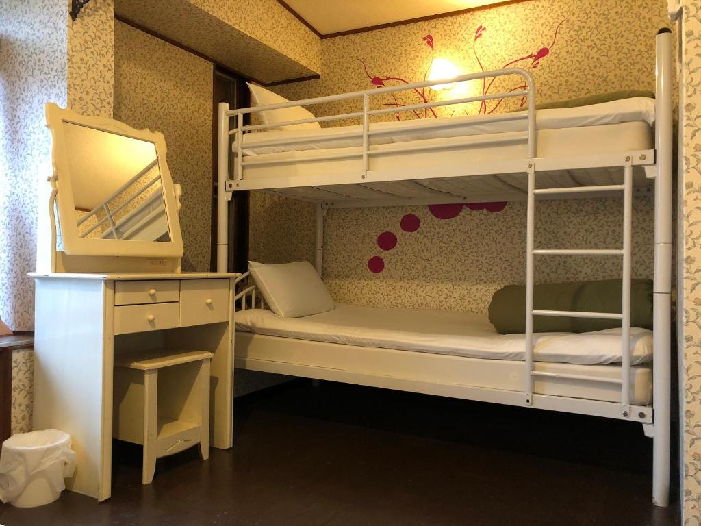 Postel nebo postele na pokoji v ubytování Hostel Yume-Nomad Kobe